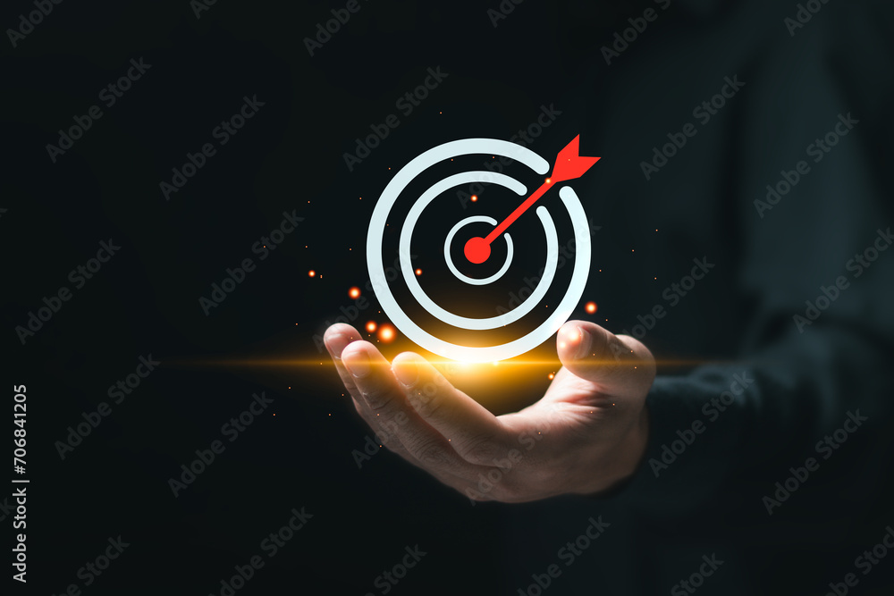 Poster targeting business concept. businessman hold virtual target icons for business objective. strategic 