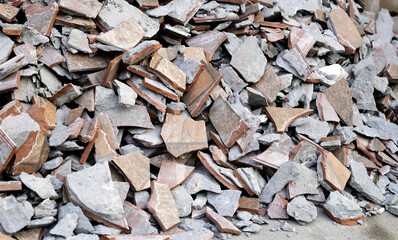 Piles of broken floor tiles from house renovations