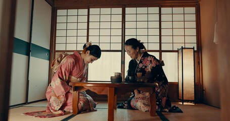 Traditional, home and Japanese women with tea for culture with leaves and herbs in tearoom....