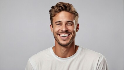 A professionally captured studio portrait featuring a handsome young white American man model, showcasing a joyful laugh and a radiant smile with perfect, clean teeth. Ideal for advertisements