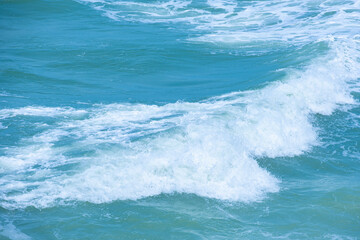 summer sea water blue surface Clear water with ripples and foam. The sunlight shone brightly.	
