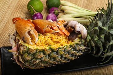 Rice with seafood in pineapple