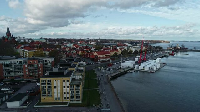 Industrial Port And Landmarks In Urban Area Of Vastervik In Kalmar, Sweden. aerial sideways shot