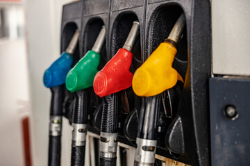 Close up of fuel nozzles on gas station.