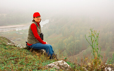 beautiful mature woman travels through the mountains of the Southern Urals