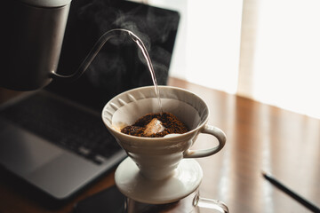 Drip coffee on your work desk in the morning