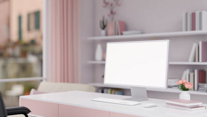 A beautiful pink girlie office room with a white-screen PC computer mockup on a desk.