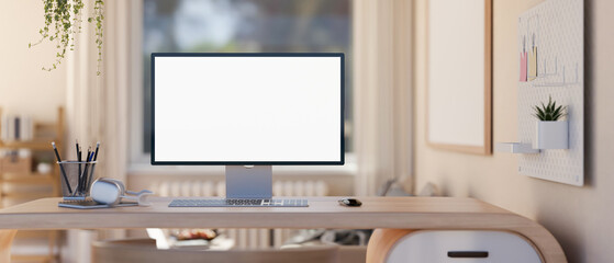 A modern, minimal home workspace in a living room with a white-screen computer mockup on a table.