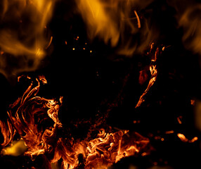 fire flame with sparks on black background.