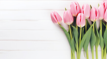 Pink Tulips on White Wooden Background, A fresh bouquet of pink tulips lies against a white wooden backdrop, creating a serene and pure springtime atmosphere.