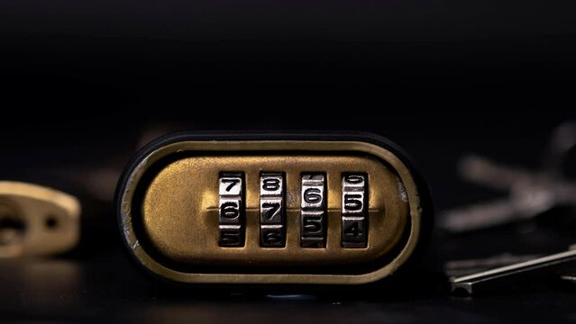 Stop motion of metal combination code lock with number rolling looping. Close-up of the number on the combination lock changed.