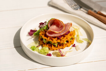 Sweet potato waffles with ham and salad