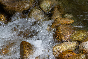 rushing water among stones