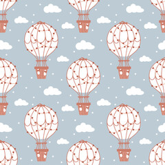 Seamless pattern with childish motifs. A flying balloon on a background of clouds and stars. Children's clothes, wallpaper, bed linen