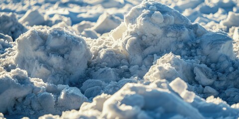 A pile of snow sitting on top of a snow-covered ground. Suitable for winter-themed designs and illustrations