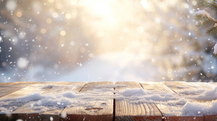 wooden table platform with dusting of falling snow with sunlight glimmering