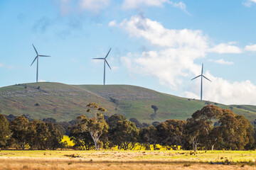Australian sustainable energy wind turbines in rural Victoria viewed from the highway, Australia