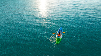 Aerial view of woman traveller exploring calm tropical bay ,Travel and Active Lifestyle concept