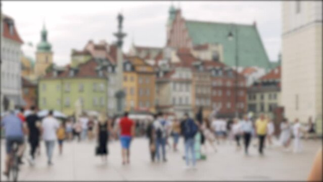 Background blurry video. Street in the center of Warsaw with tourists.