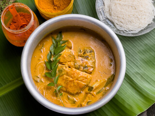 Kerala fish curry coconut milk gravy , cooking spicy Goan fish curry , Indian fish curry Bengali fish curry in coconut milk Kolkata, India Sri Lanka. Lankan food.