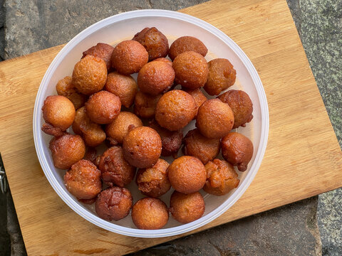 Homemade Kerala sweet snack sweet appam made with rice flour jaggery fried in coconut oil. Traditional Kerala food