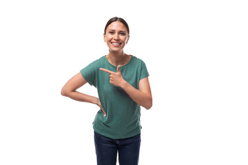 active smiling young caucasian brunette woman in green t-shirt draws attention