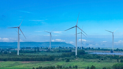 The wind turbines generating electricity with blue sky - Alternative renewable energy concept