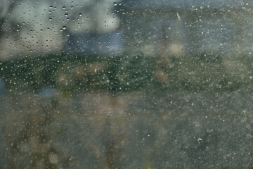 Window glass with water drops, view from inside