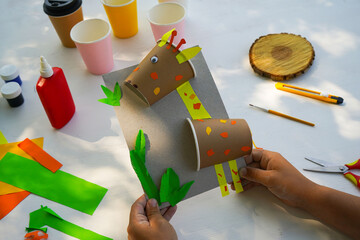 Craft Paper Cup animal cartoon character. DIY Homemade giraffe applique from a paper cup. Kids...