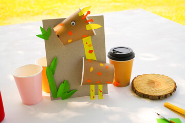 Craft Paper Cup animal cartoon character. DIY Homemade giraffe applique from a paper cup. Kids...