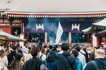 Tourists visit Sensoji Temple or Asakusa Kannon Temple is a Buddhist temple located in Asakusa. Landmark and popular for tourist attraction and Travel destination in Tokyo, Japan and Asia concept - obrazy, fototapety, plakaty