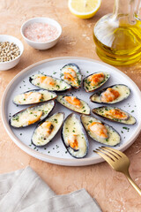 Baked mussels with cheese and herbs. Seafood. Healthy eating.