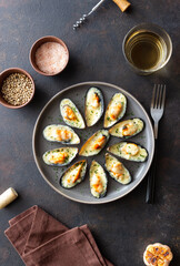 Baked mussels with cheese and herbs. Seafood. Healthy eating.