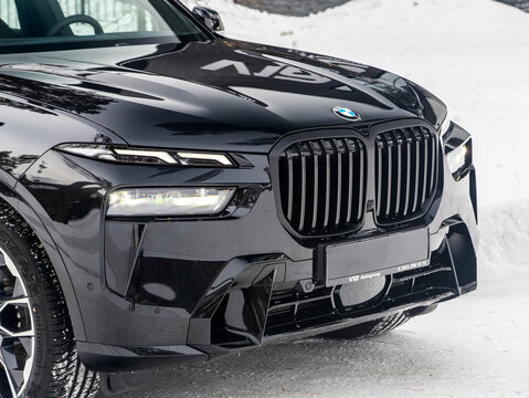 Novosibirsk, Russia - January  05 , 2024: black  BMW X7 ,  car with clear light headlight, bumper,  foglights