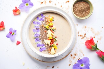 Obraz na płótnie Canvas vegan smoothie bowl topped with dollop of almond butter