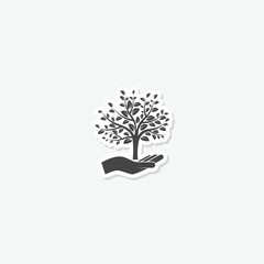 Hand with a tree logo sticker isolated on gray background