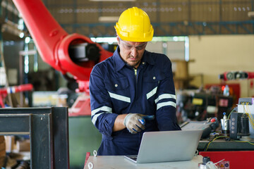 Robotic technician repairing - fixing a automated machine.