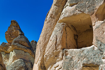 Cappadocia landscape soft volcanic rock, shaped by erosion into towers.