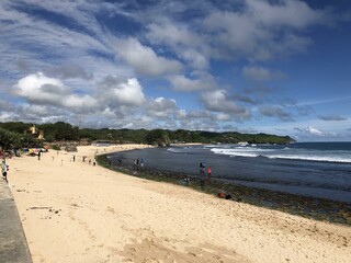 Beach atmosphere in Yogyakarta, Indonesia with stunning views of the sea, coral rocks, waves, white sand and nature