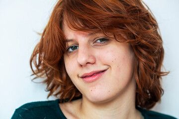  close-up portrait of a pensive teenage girl with red hair with a stylish anime hairstyle