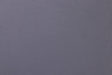 Seamless plastic texture background. Close-up of a detail from a gray metallic surface of a cosmetic bag. Beautiful backdrop. Macro.