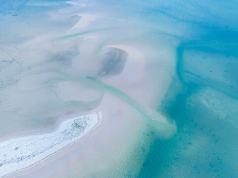 Abstract aerial view of water and sand patterns at the Elliot Heads Beach, Bargara, Queensland 