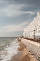 Coastal residential areas with a modern hotel and restaurant complex alongside sandy beaches....