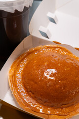 angle view bread and cup of drink at vertical composition