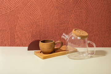 set of wooden cup, medium glass Teapot, and wooden coaster with japanese red texture. pedestal oriental for tea product. Product presentation. geometry shape decoration concept oriental asian vibes
