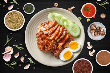 The photo of Thai food with sauce, herb, flavor on the dark wood table background