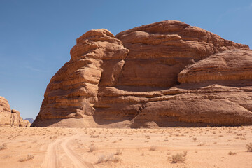 Fototapeta na wymiar Majestic Rock Formation Dominating the Wadi Rum Desert Landscape