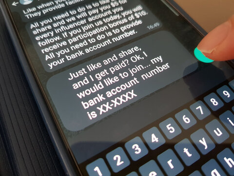 Job scam concept. A person receive a job scam message asking him to provide bank account number - Powered by Adobe