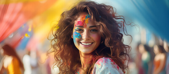 Portrait of a young woman at the Holi festival, expressing joy. Cheerful Holi Moments: Woman Enjoying the Festival - obrazy, fototapety, plakaty