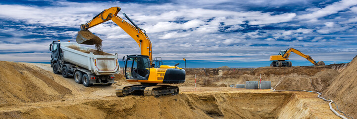 excavator is working and digging at construction site